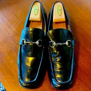 Size 12 black Gucci loafers.